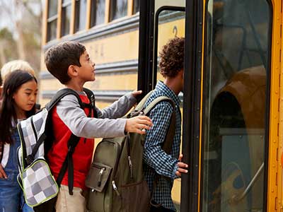 School Kids Getting on Bus