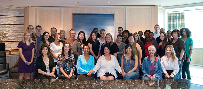 Linda Reinstein, center bottom in white, with members of Baron & Budd's asbestos care team.